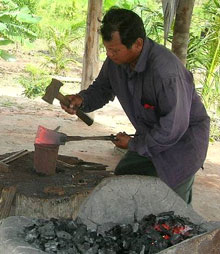 Khat Rim working the coals